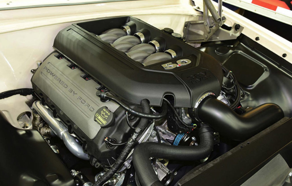 A custom pro touring 1961 Ford Starliner modified with a 5.0 Coyote crate engine.